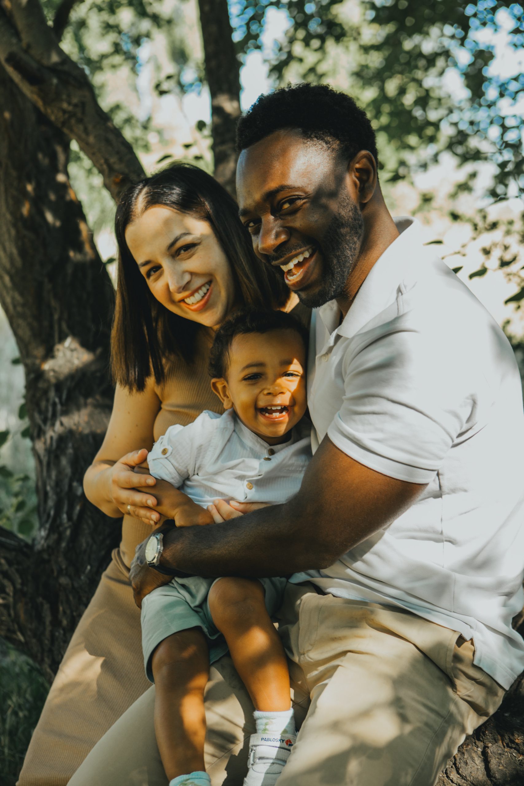 Black mother and child dancing in the park during a family mini photo session. Family photography, relaxed, playful and child-led family photos by Kate Mannings Photography